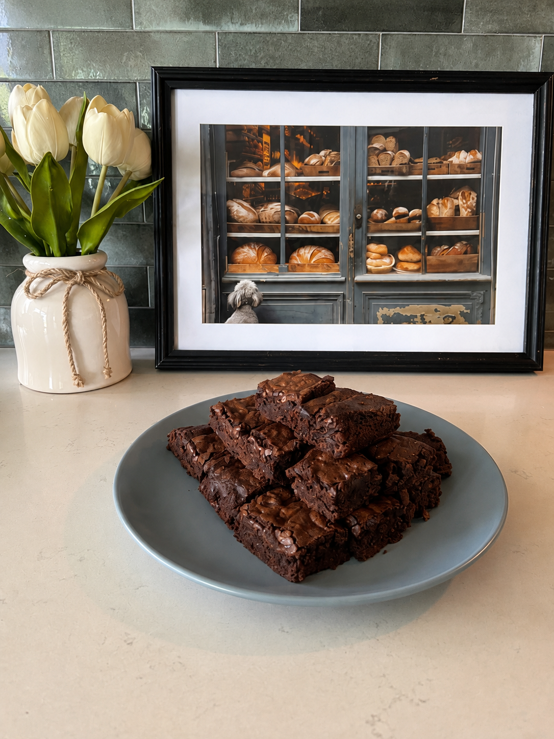 Stack of fudgy homemade brownies on a plate, Kneadful Bread Co.